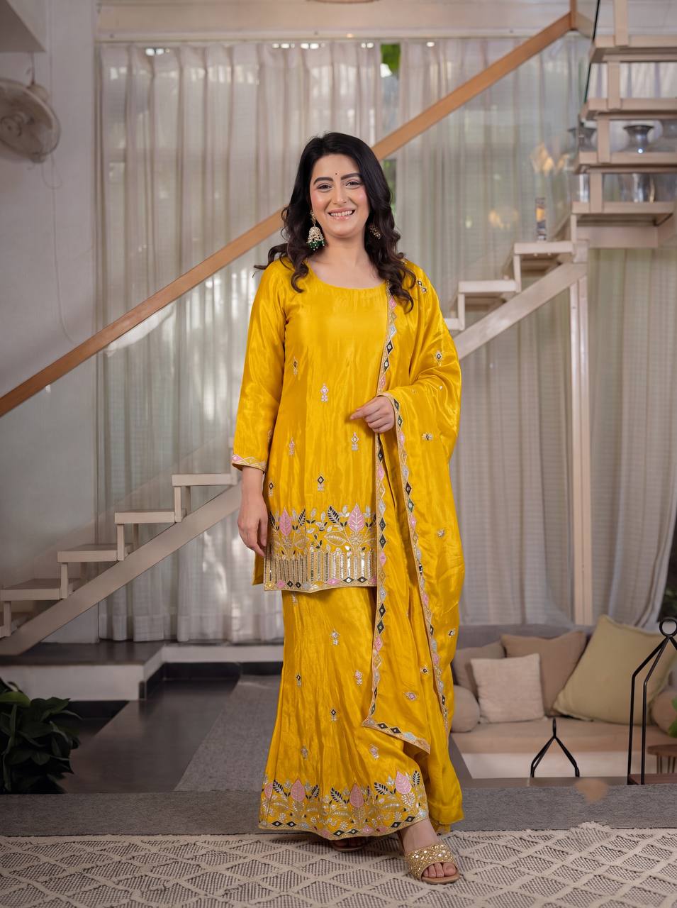 Elegant Rust Orange Silk Kurta and Flared Palazzo Set Adorned with Intricate Multicolored Botanical Embroidery and Mirror Work